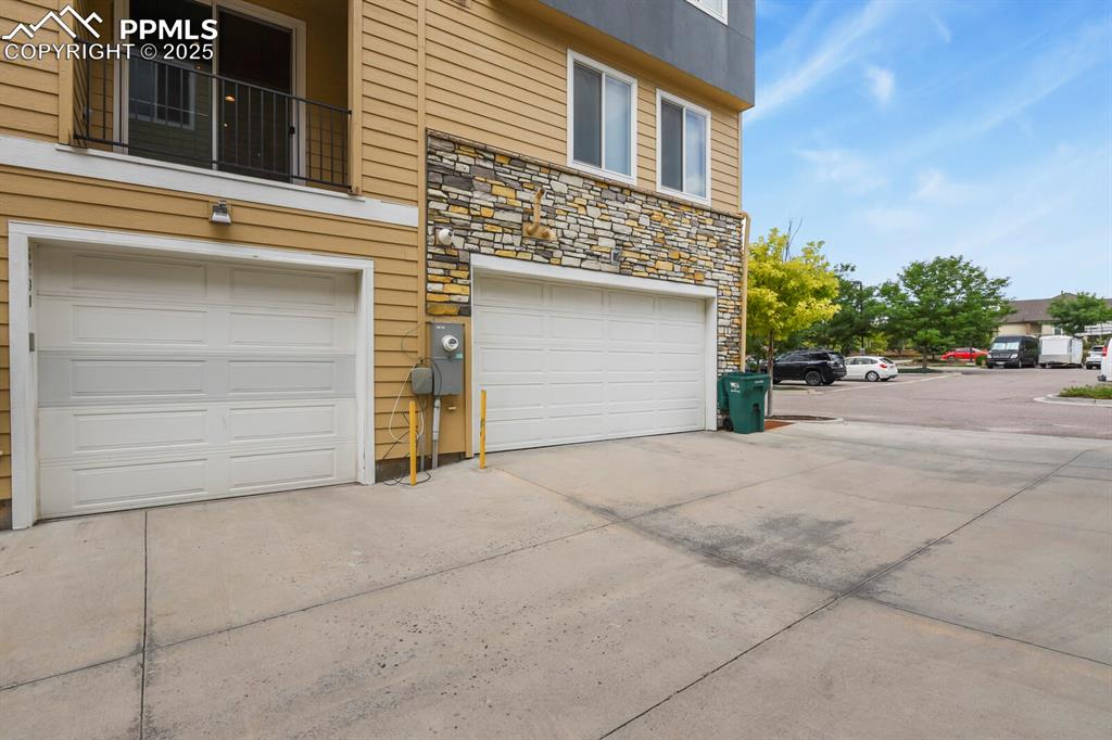 Image 25 of 29: Garage - door is second one in and is 1 car wide- 2 car tandem 