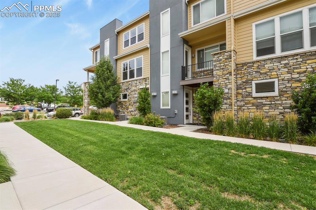 Image 3 of 29: View of exterior with nice lawn space in front