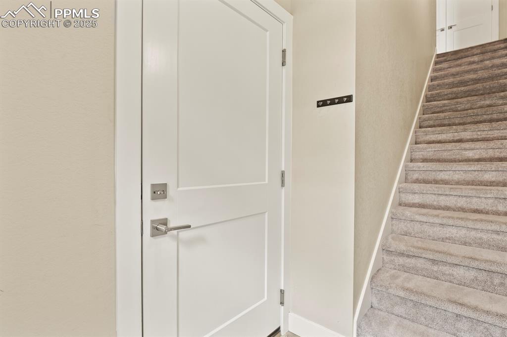 Image 4 of 29: Entry- front door and garage providing access to main level