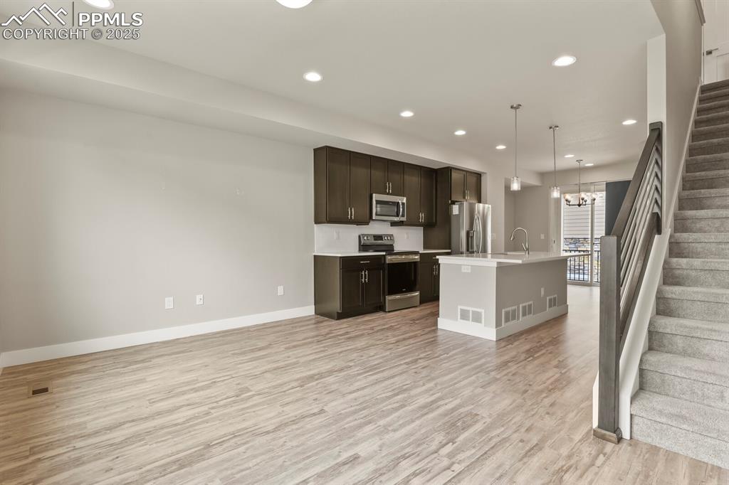 Image 5 of 29: Open floor plan- main level living room 