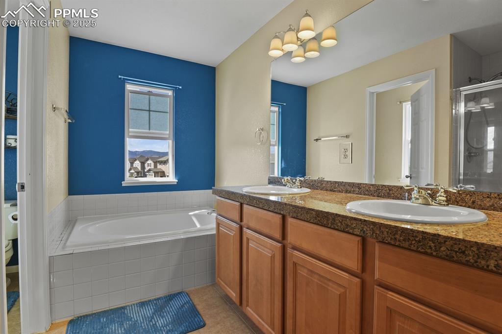 Image 27 of 49: Main bathroom featuring tile patterned flooring, independent shower and bat