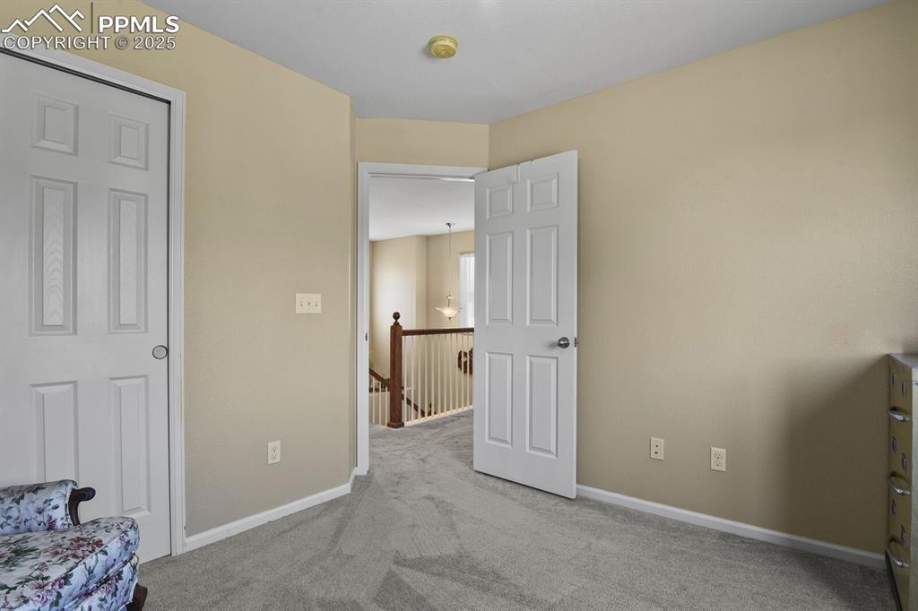 Image 30 of 49: Unfurnished bedroom with light colored carpet