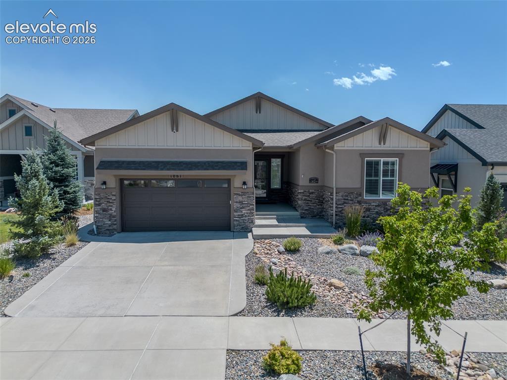 Image 1 of 50: Contemporary ranch-style exterior featuring a neutral stucco facade and sta