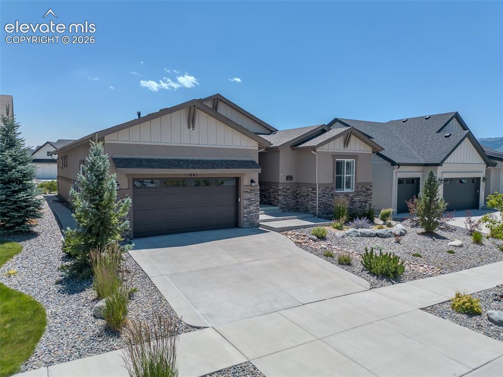 Image 1 of 50: Contemporary ranch-style residence featuring a combination of stucco and st