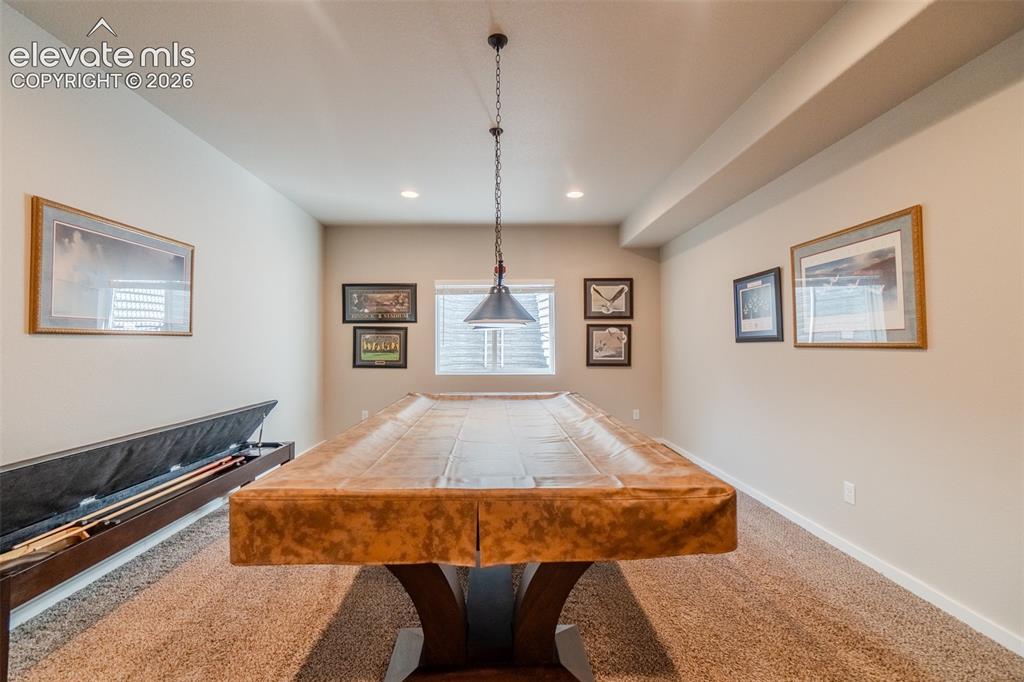 Image 35 of 50: Entertainment room featuring wall-to-wall carpeting, recessed lighting, and