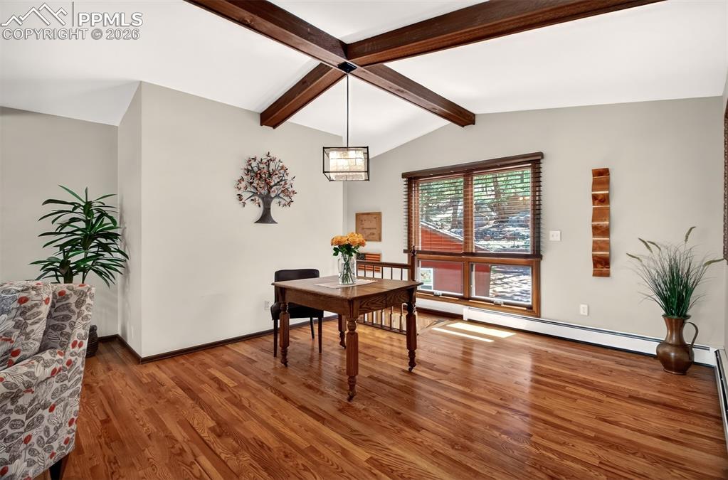 Image 12 of 50: Main level office with wood burning fireplace