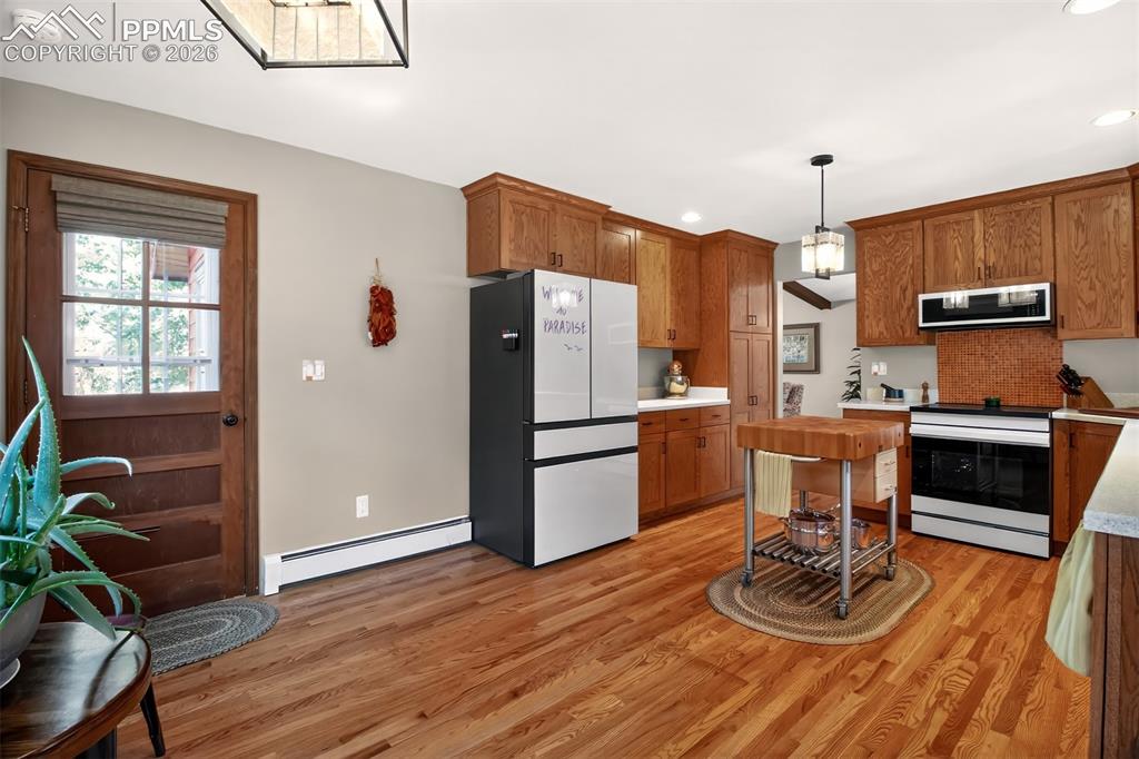 Image 15 of 50: Newer renovated kitchen with a John boos maple butcher black, Samsung bespo