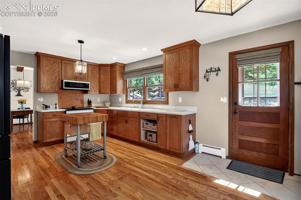 Image 19 of 50: one of two walk out decks off the kitchen