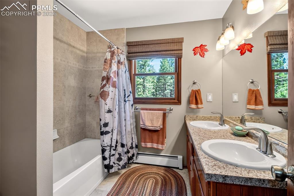 Image 9 of 50: Primary bedroom on main level with dual walk in closets 