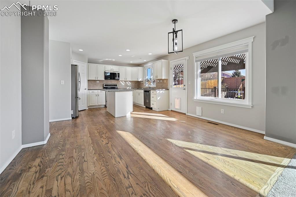 Image 11 of 49: Unstaged dining room with walkout