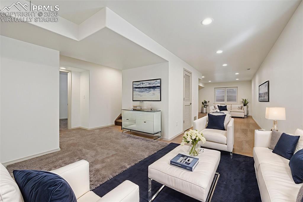 Image 30 of 49: Virtually staged basement ready for your family room, game room, or theater