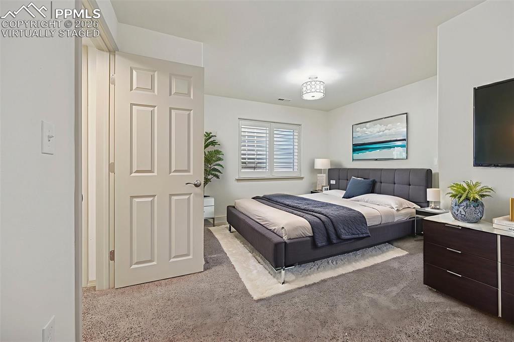 Image 37 of 49: Virtually staged basement bedroom