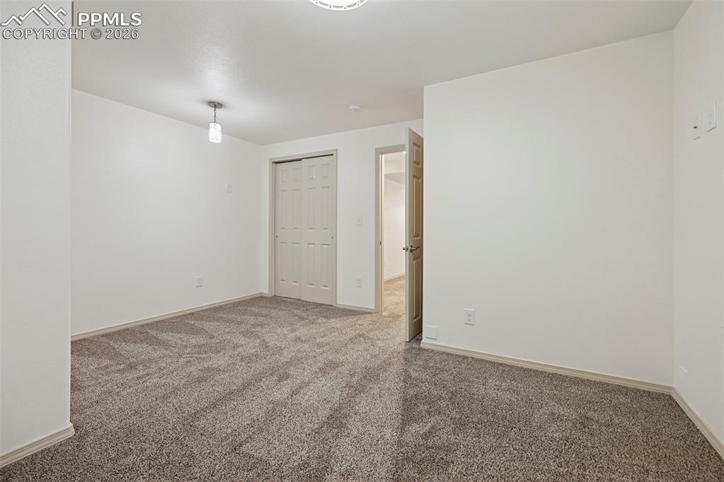 Image 39 of 49: Unstaged basement bedroom