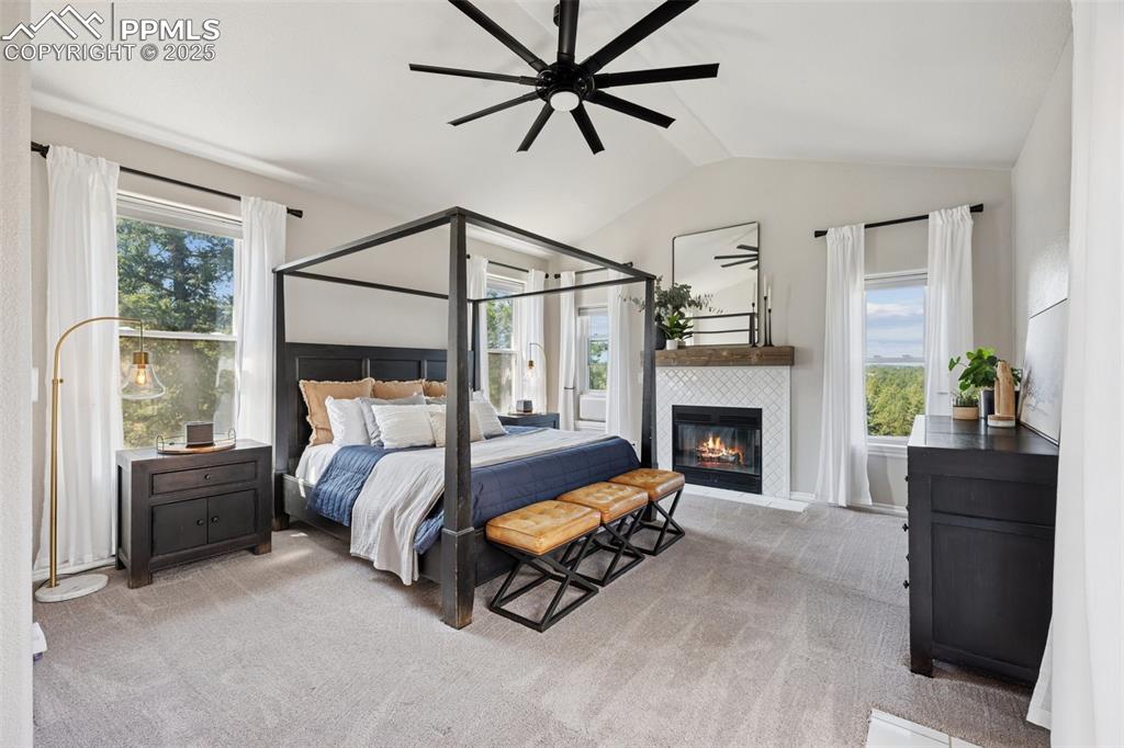 Image 22 of 49: Primary Suite w/ Attached Ensuite, Cozy Fireplace, Walkout to Deck and Beau