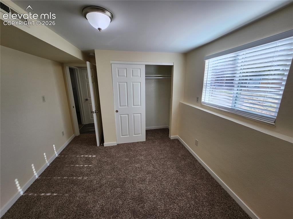 Image 28 of 29: basement bedroom