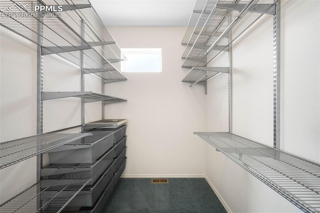 Image 14 of 37: Primary bedroom closet