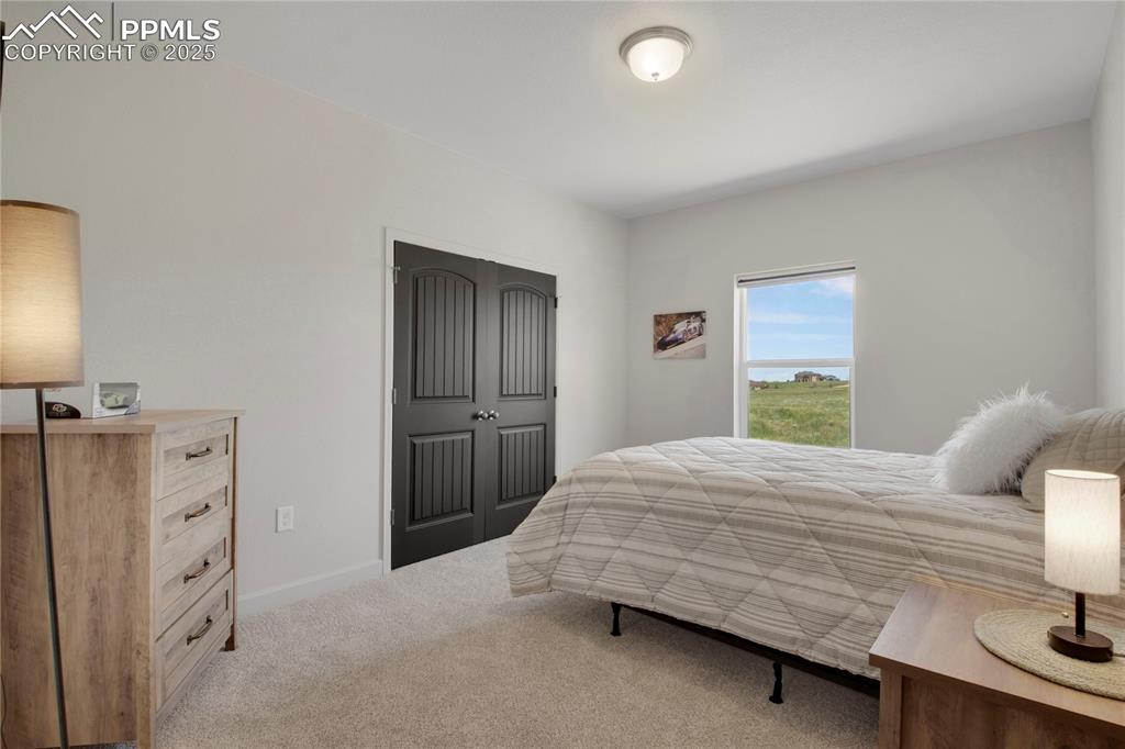 Image 21 of 25: Bedroom #2 featuring carpet flooring and baseboards