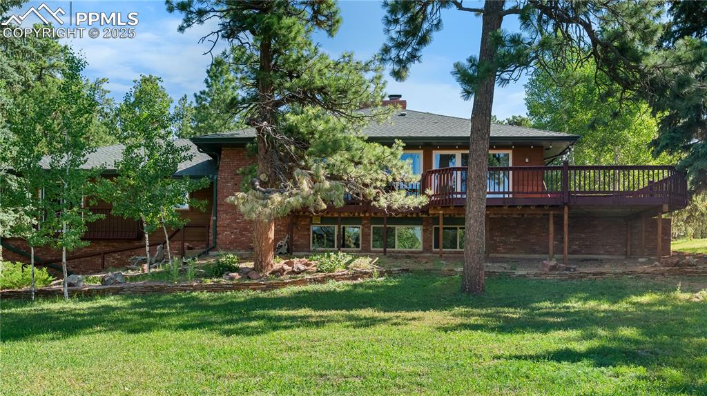 Caption: This beautiful home is surrounded by mature trees with a large side/corner lawn.