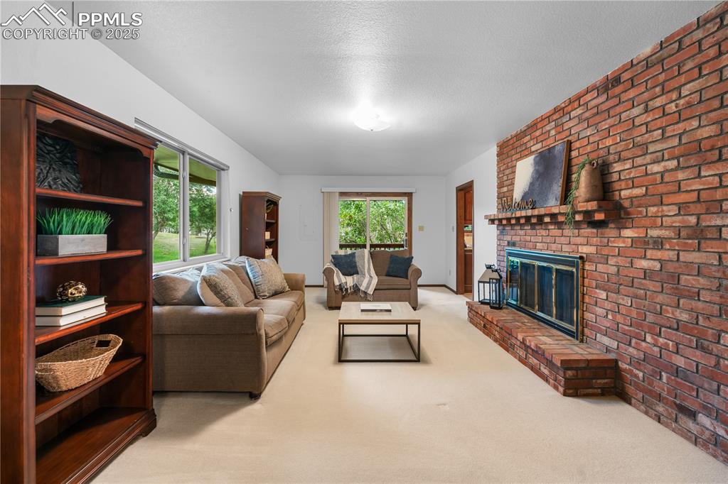 Image 13 of 44: Separate family room for cozy family time.