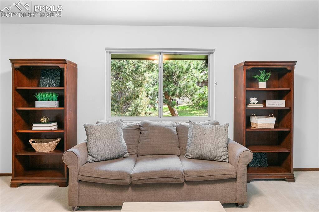 Image 14 of 44: Separate family room for cozy family time.