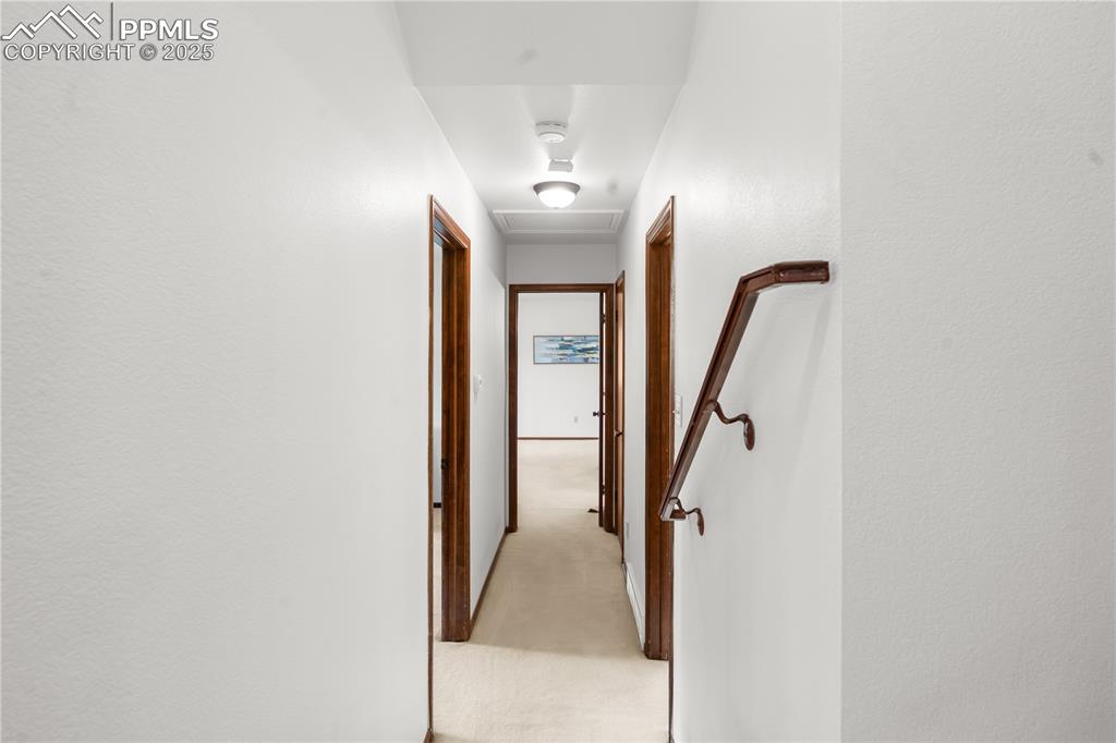 Image 15 of 44: Upper level hallway to Primary bedroom and bedroom 2