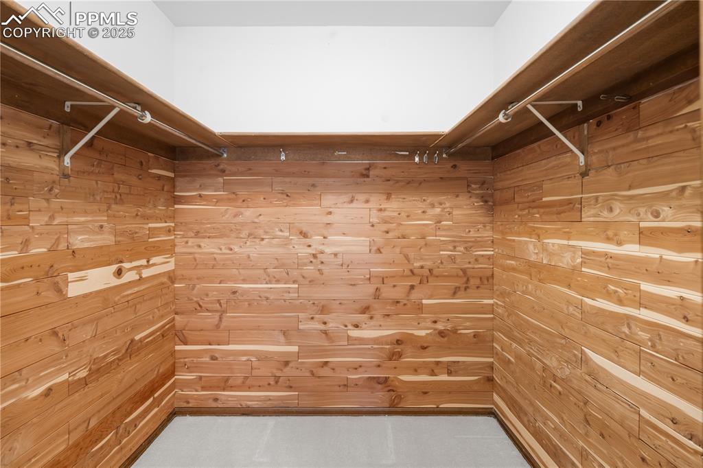 Image 20 of 44: Cedar lined closet in primary bedroom
