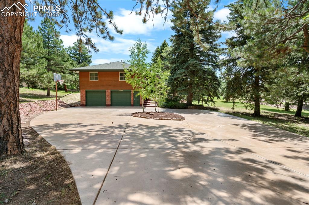 Image 38 of 44: Beautiful new concrete circular driveway.