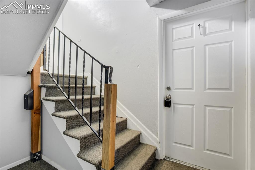 Image 4 of 42: Lower level entrance to Unit 1