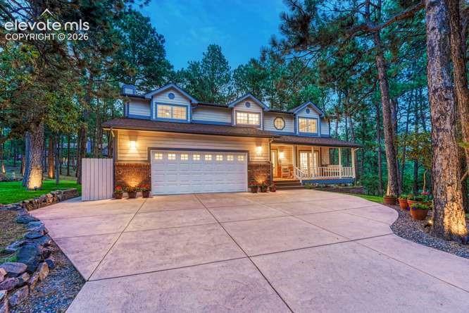 Caption: Beautifully maintained home with extended concrete driveway