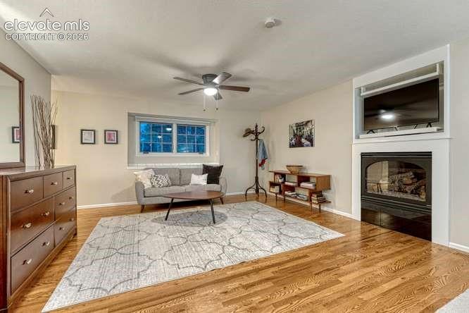 Image 12 of 49: primary bedroom offers gas fireplace and sitting area