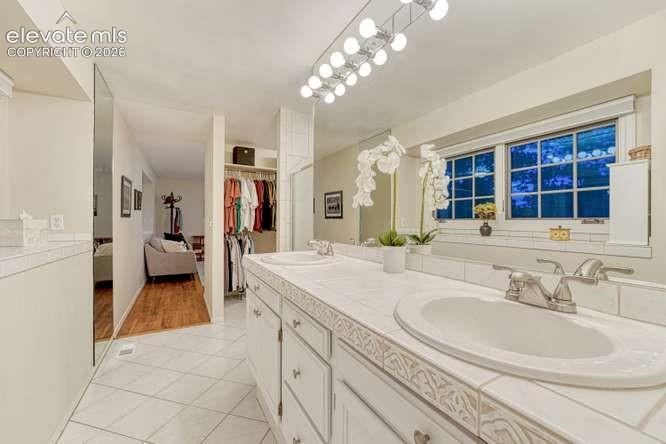 Image 16 of 49: Primary bath with walk in closet
