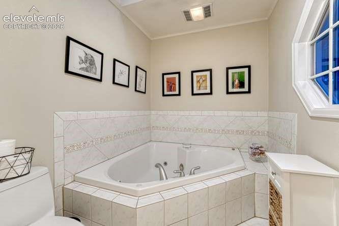 Image 17 of 49: private Jetted tub in primary bath