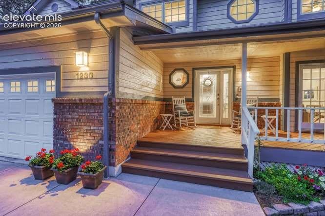 Image 2 of 49: enjoy morning coffee or sunsets on the covered porch