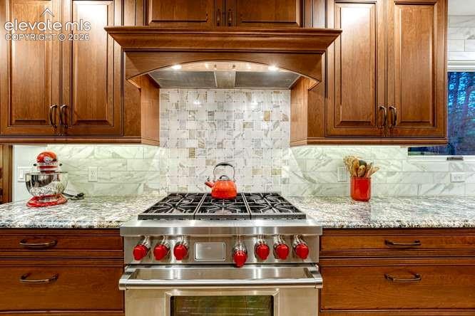 Image 3 of 49: gourmet kitchen with upgraded cabinets and Wolf gas stove