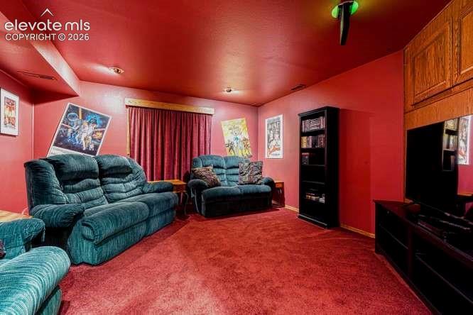 Image 35 of 49: Theater room in basement. TV, chairs, speakers included.