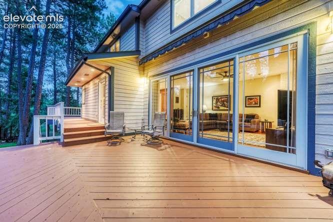 Image 42 of 49: deck with Bi-Parting sliding glass door to allow you to bring the outside i