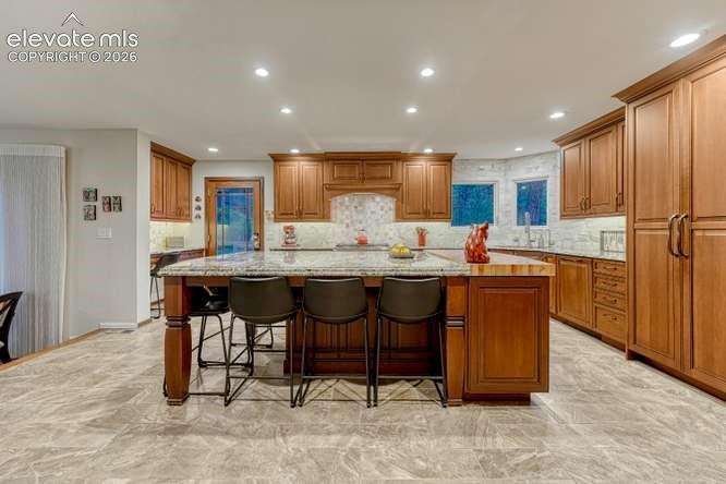 Image 5 of 49: Custom cabinetry and Miele refrigerator, Boos Block® Butcher block island e