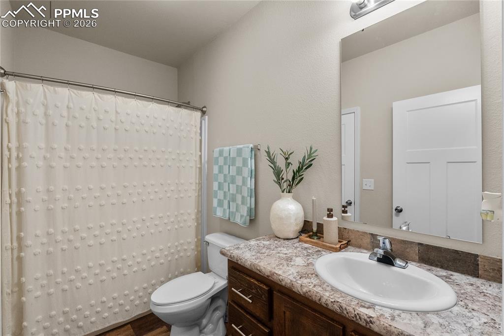 Image 11 of 31: full bath, next to first bedroom 