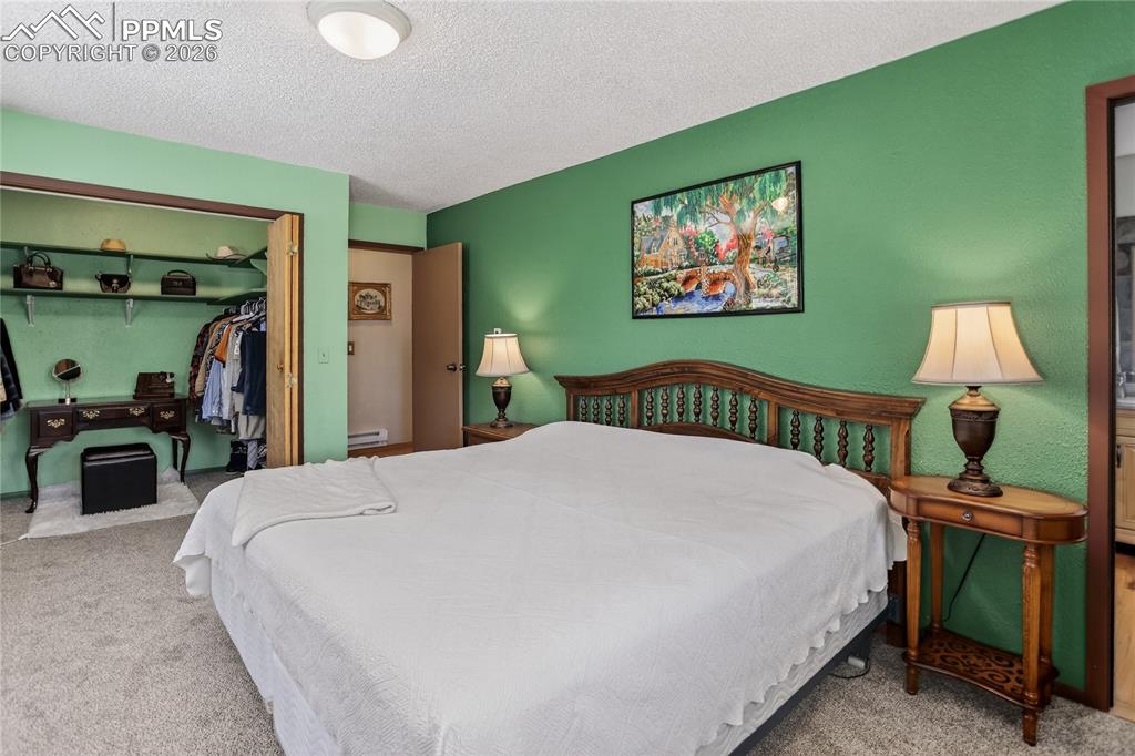 Image 20 of 50: Main level primary bedroom.