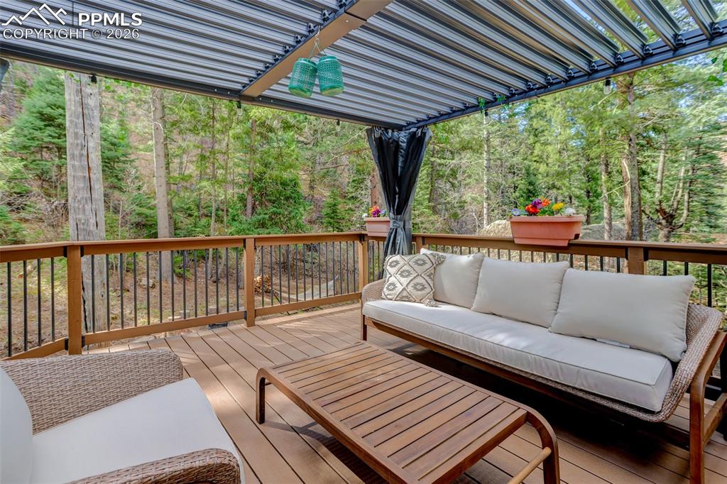 Image 34 of 50: Deck off lower level flex room.