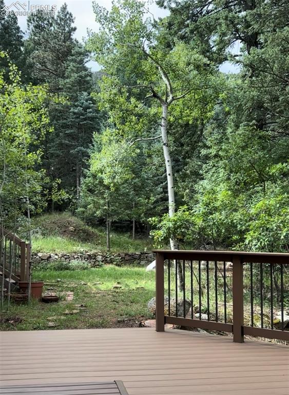 Image 35 of 50: Deck off lower level flex room.