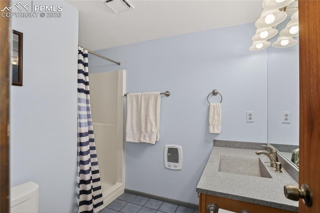 Image 39 of 50: Lower level 3/4 hall bath.