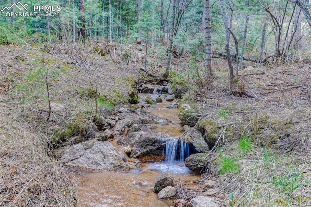 Image 45 of 50: Sutherland Creek runs through the property!
