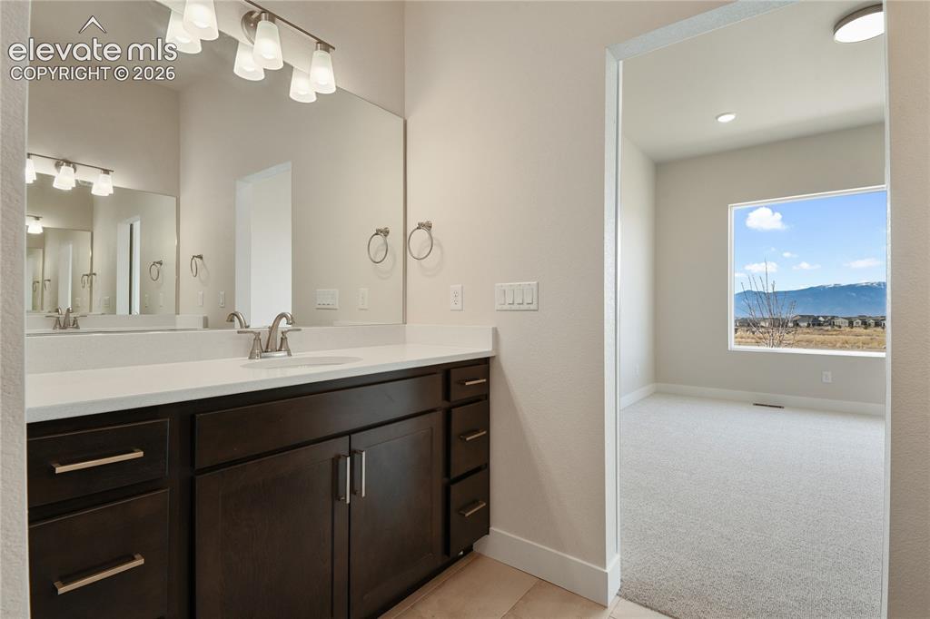 Image 14 of 50: Two separate vanities with loads of counter space