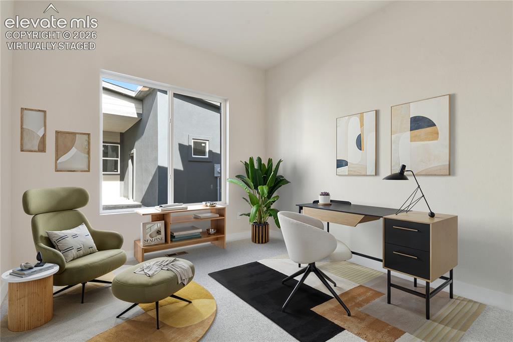 Image 16 of 50: Second main level bedroom. Virtually Staged