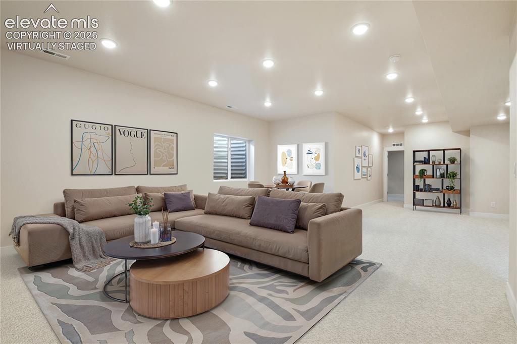 Image 19 of 50: Lower level family room with 9 foot ceilings and so many possibilities. Vi