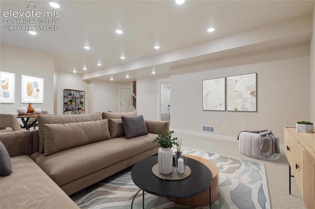 Image 20 of 50: Another angle of the lower level family room. Virtually Staged