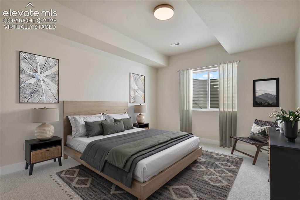 Image 22 of 50: Lower level Third bedroom with walk-in closet. Virtually Staged