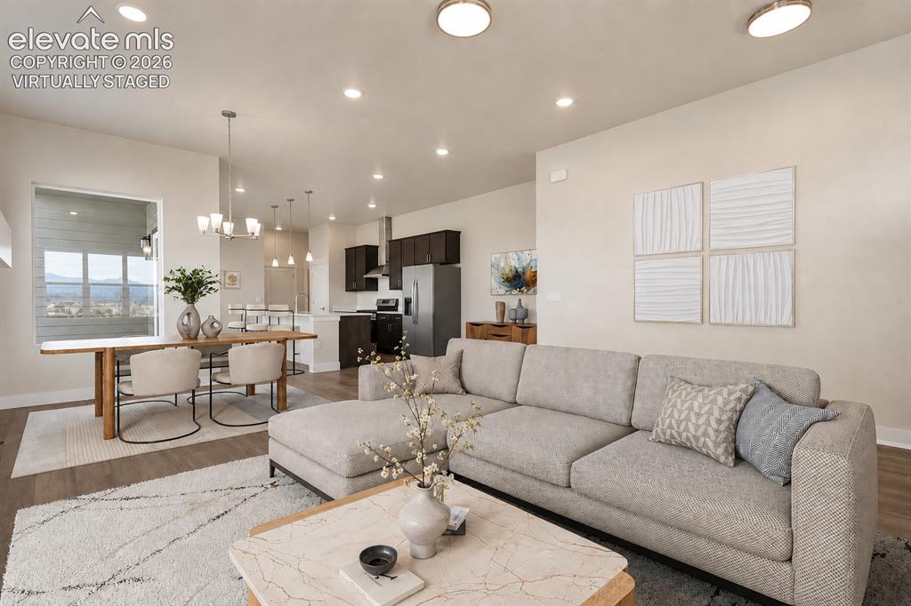 Image 5 of 50: Open concept floor plan flows easily from living to dining to kitchen. Virt