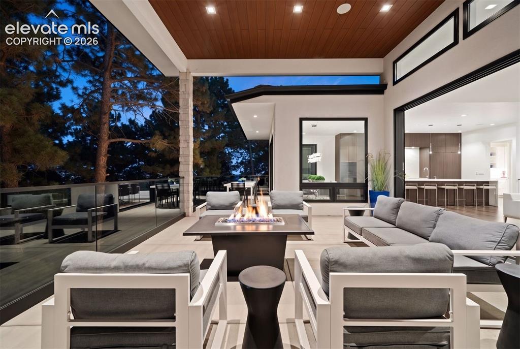Image 4 of 50: Soaring ceilings, expansive walls of glass, and a seamless open-concept des